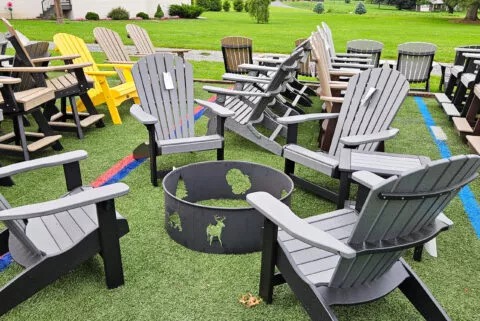 Adirondack chairs circled around a fire pit